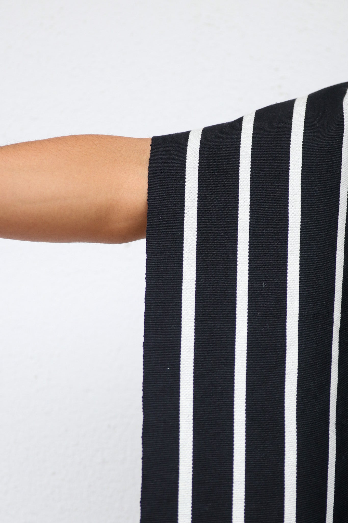 BLACK PONCHO WITH WHITE STRIPES