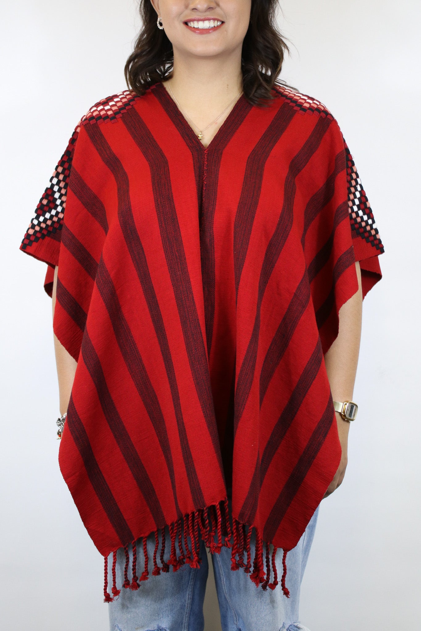 RED PONCHO WITH BLACK STRIPES AND DETAILED SLEEVES