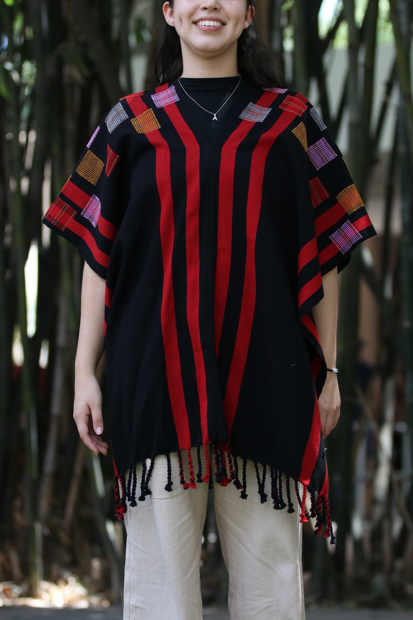 BLACK PONCHO WITH RED STRIPES