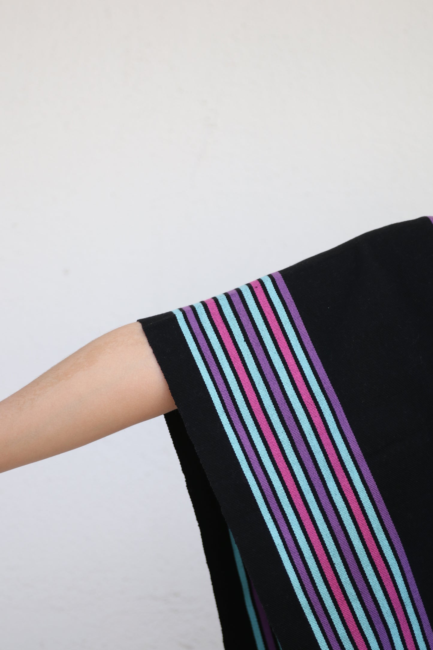 BLACK PONCHO WITH PURPLE STRIPES