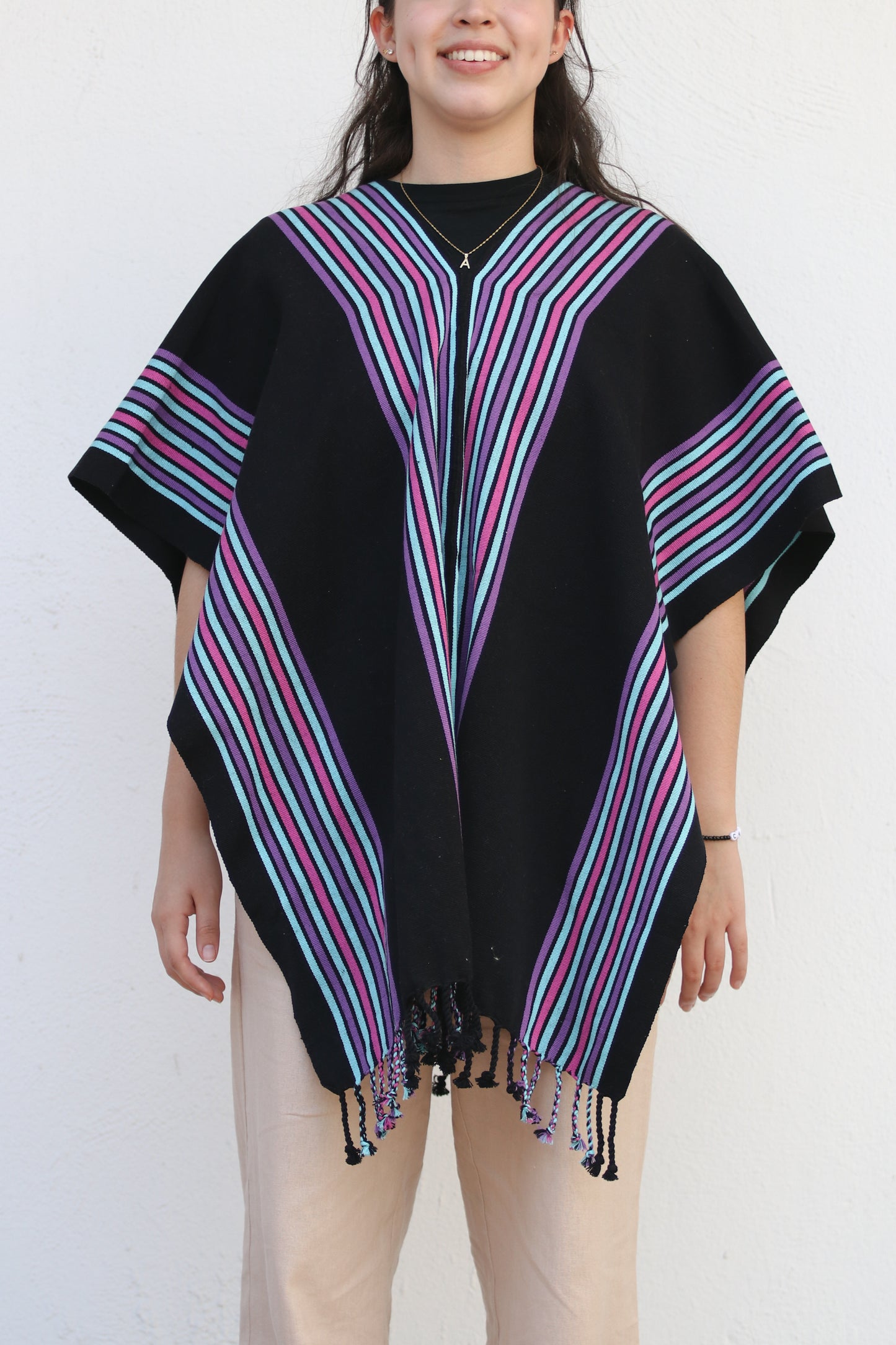 BLACK PONCHO WITH PURPLE STRIPES