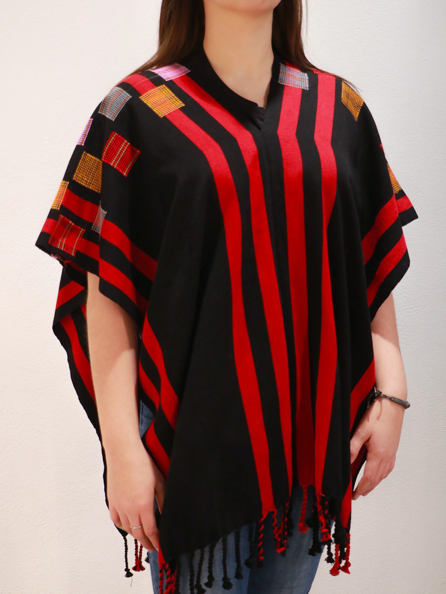 BLACK PONCHO WITH RED STRIPES